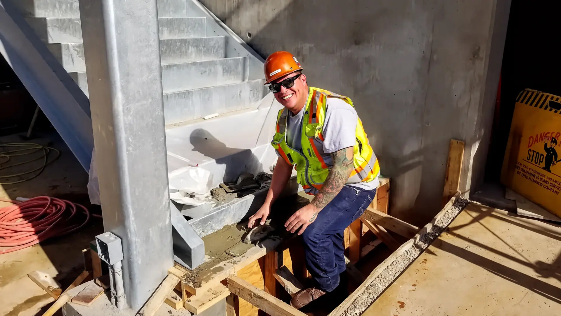 Hands On Labor worker wearing a hardhat on a San Diego job site
